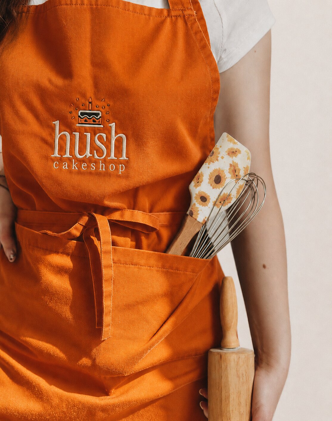 Avental laranja da equipa HUSH